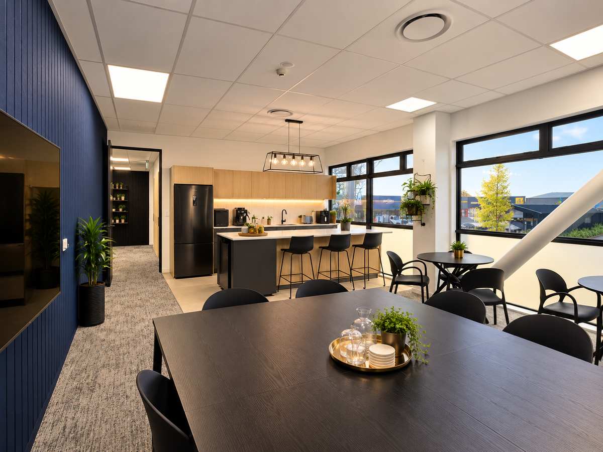 Shared dining table with the kitchen and bar stools behind